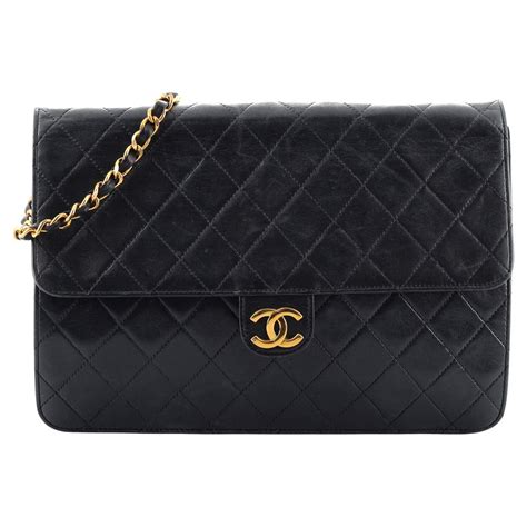 vintage chanel leather clutch|Chanel vintage clutch with chain.